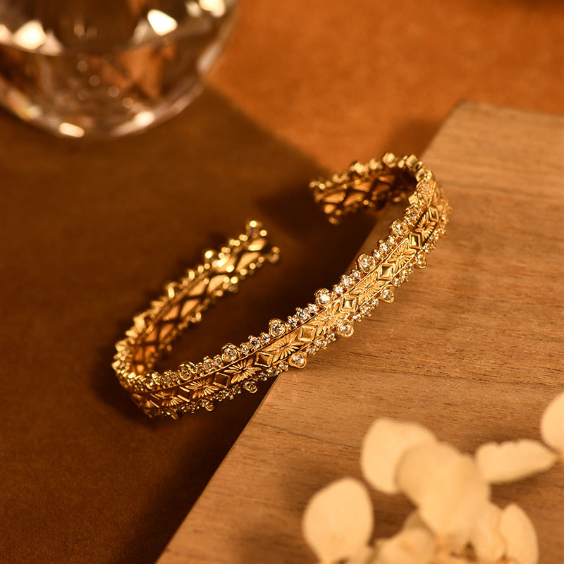 18K gold-plated bracelet features layered filigree craftsmanship