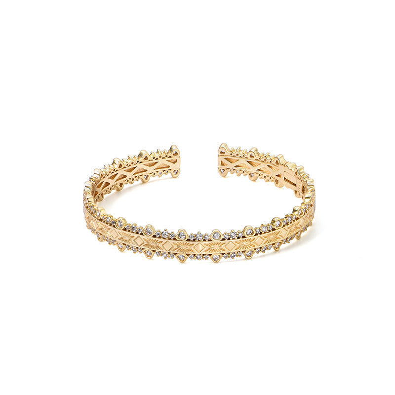 18K gold-plated bracelet features layered filigree craftsmanship